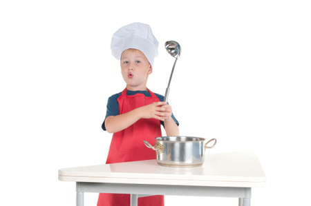 Little cheff explaining recipe holding the ladle in handの写真素材