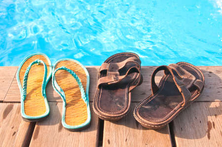 Two pairs of flip-flops - men's and women'sの写真素材