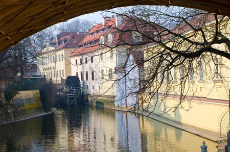 Old water mill on a river in Prague, Bohemia, Czech Republic.の写真素材