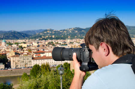 Young man taking an image of Florence, Italyの写真素材