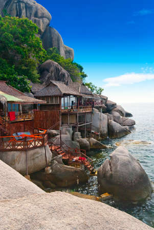 Tropical wooden villas on the rocks of a bayのeditorial素材