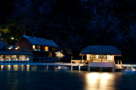 Villas of a tropical seaside resort at night, Asian island.の写真素材