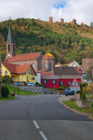 Empty country road leading to a typical french vilage.の写真素材