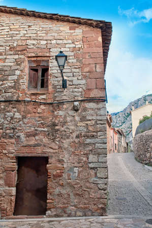 Old ruin wall with antique lantern, Collbato, Spainのeditorial素材
