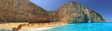 ZAKINTHOS ISLAND, GREECE - JUNE 2015: Tourists in famous Navagio Bay with Wrecked Shipのeditorial素材