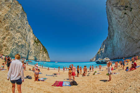 ZANTE ISLAND, GREECE - CIRCA JUNE 2015: Tourists taking selfie shots and enjoying Navagio Bay with Pirate's Shipwreckのeditorial素材