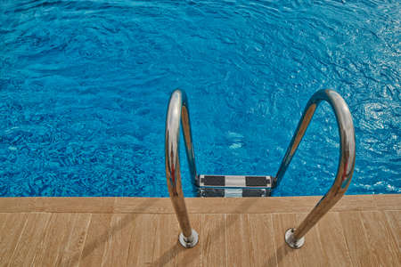 Refreshing Swimming Pool Welcoming Stairs Abstract Backgroundの写真素材