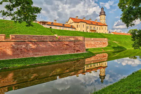 Scenic Nesvizh Castle in Belarus with reflections in waterのeditorial素材