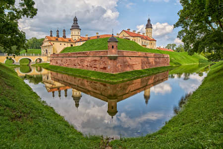 Scenic Nesvizh Castle in Belarus with reflections in waterのeditorial素材