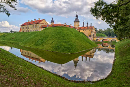 Scenic Nesvizh Castle in Belarus with reflections in waterのeditorial素材