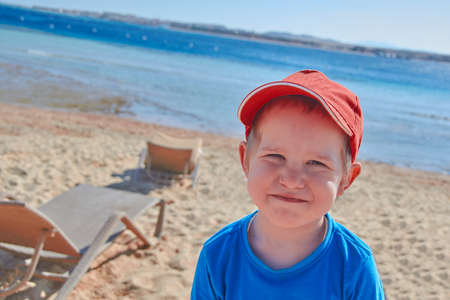 Happy smiling boy at Red Sea Shoreの写真素材
