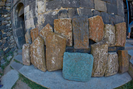 Stone khachkars near famous Sevanavank Monastery at Sevan Lake in Armeniaの写真素材