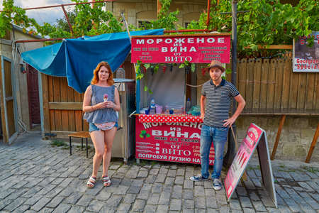 MTSKHETA, GEORGIA - 31 JULY 2017: Young woman tasting genuine icecream made from wine のeditorial素材
