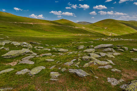 High-altitude abstract mountain landscape with rocks and valleys in the backgroundの写真素材