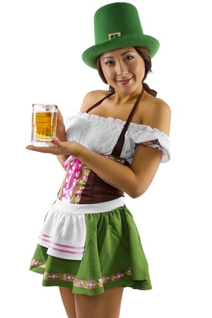 Asian waitress in a St Patricks Day costume holding a mug of beer の写真素材
