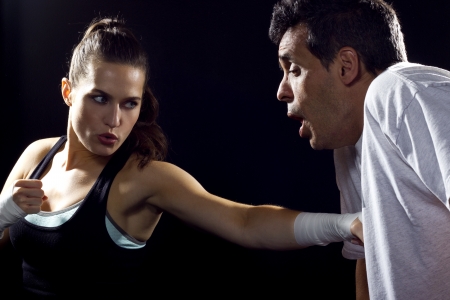 young fit woman fighting a manの写真素材