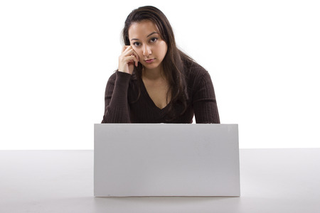 young caucasian woman with a blank sign on her deskの写真素材