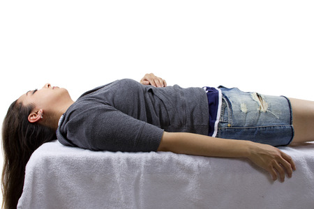 unconscious woman waking up. isolated for composites.の写真素材