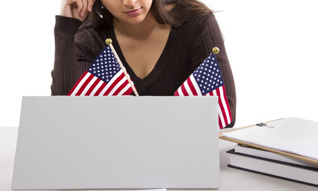 State or Federal female worker with a blank sign on her deskの写真素材