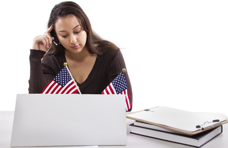 State or Federal female worker with a blank sign on her deskの写真素材