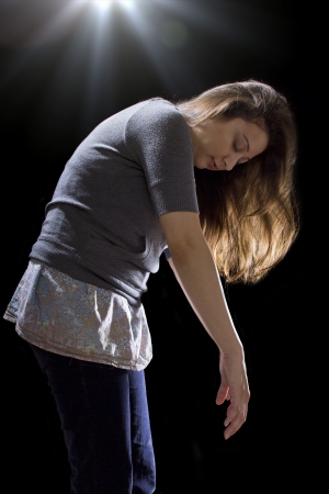 young woman is being taken by a UFO by levitationの写真素材