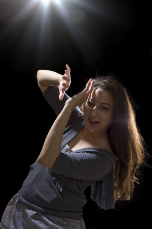 young woman seeing bright glowing orbs from aboveの写真素材