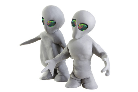 gray alien made of clay on a white backgroundの写真素材