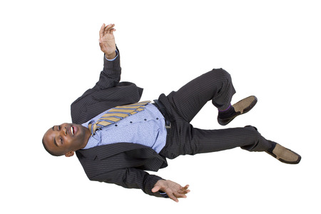 falling young black businessman from top viewの写真素材