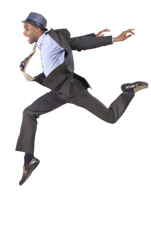 young black businessman leaping / jumping highの写真素材