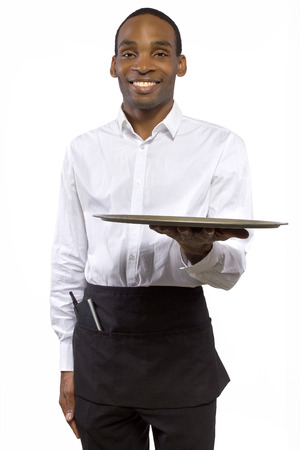 black male waiter carrying a blank tray for compositesの写真素材