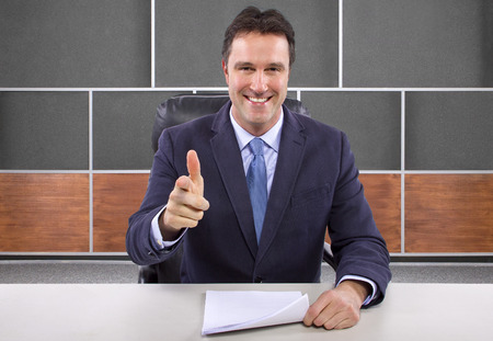 male news anchor or reporter in a studio set の写真素材