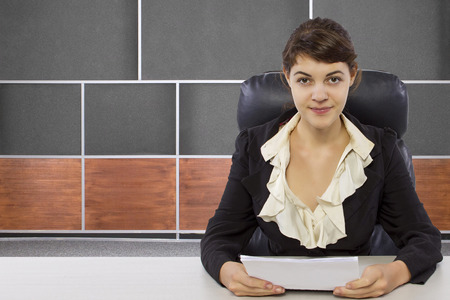 young female reporter in a news room setの写真素材