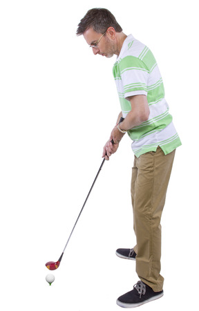 middle-aged man staying healthy and active by playing golfの写真素材