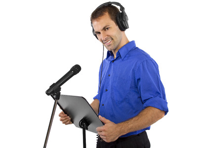 male voice over artist or singer on a microsphone wearing a blue shirt on a white backgroundの写真素材