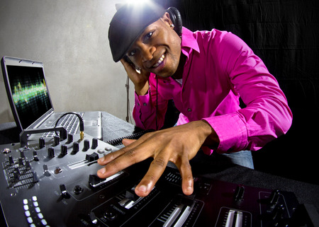 Cool African American male DJ playing music at a partyの写真素材