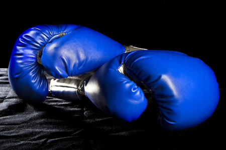 boxing gloves or martial arts gear on a black backgroundの写真素材