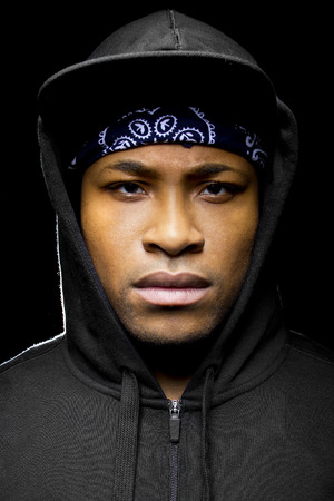 Portrait of a hooded black man tired of racial discriminationの写真素材