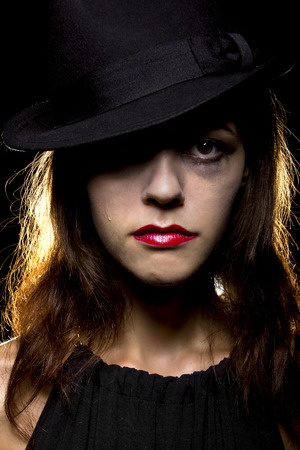 smeared make-up by crying tears on a noir style sad womanの写真素材