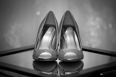 Close up of bridal wedding shoes during pre ceremony preparationsの写真素材