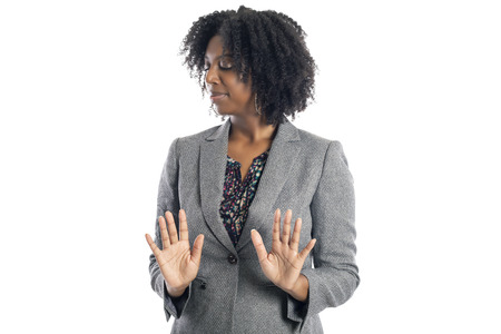 Black African American female businesswoman isolated on a white background looking disgusted and embarrassedの写真素材
