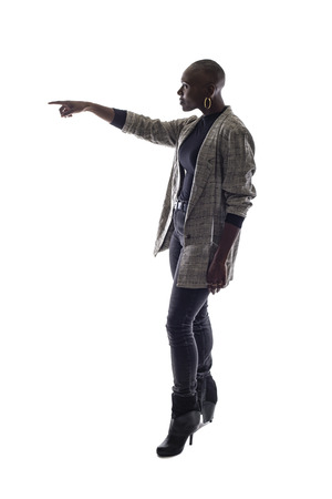 Black female African American model on a white background.  She is posed pointing forwardの写真素材