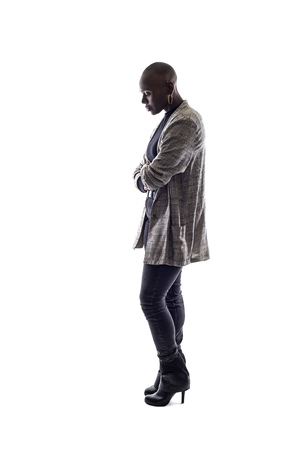 Black female African American model on a white background.  She is posed with a sad or depressed postureの写真素材