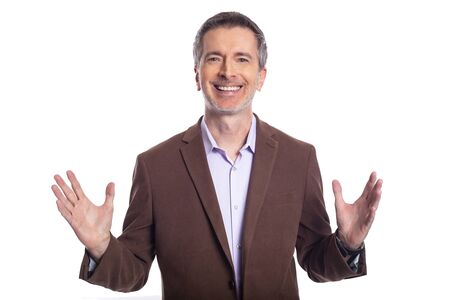 Middle aged bearded businessman on a white background wearing a brown jacket.  The mature man looks like a happy and smiling business executive.の写真素材