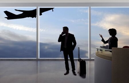 Stressed out businessman passenger arguing with a flight attendant or receptionist at an airport check in counter.  He is angry because of a delayed or cancelled flight.の写真素材
