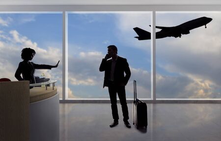 Stressed out businessman passenger arguing with a flight attendant or receptionist at an airport check in counter.  He is angry because of a delayed or cancelled flight.の写真素材