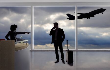 Stressed out businessman passenger arguing with a flight attendant or receptionist at an airport check in counter.  He is angry because of a delayed or cancelled flight.の写真素材