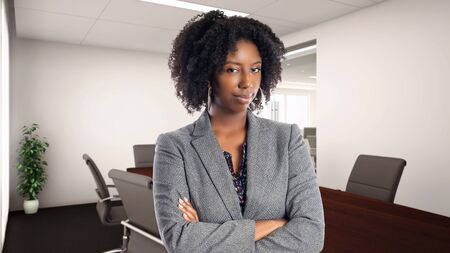 Black African American businesswoman in an office looking disgusted.  She is an owner or an executive of the workplace.  Depicts careers and startup business.の写真素材