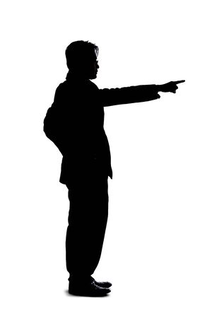 Full body silhouette of a businessman isolated on a white background. He is pointing at copy or text space like he is advertising or promoting something.の写真素材