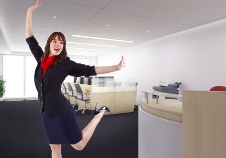 Pretty female office worker or businesswoman looking overjoyed and excited.  She looks like she got a promotion or raise and is feeling optimistic and happy. の写真素材