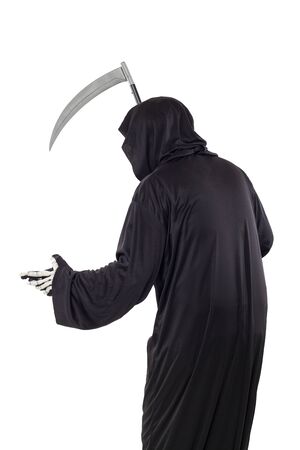 The grim reaper or death halloween costume isolated on a white background.  The skeleton is wearing a hooded black robe. Side view in profile for composites.の写真素材